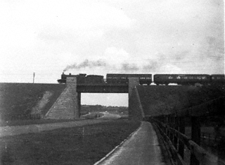 Photograph of Unknown Train with Mixed Carriages